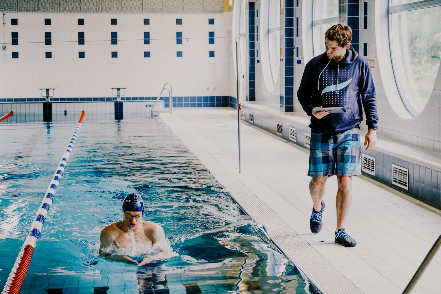 Swimtraxx One swimmer and coach in pool