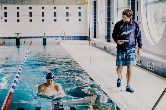 Swimtraxx One swimmer and coach in pool